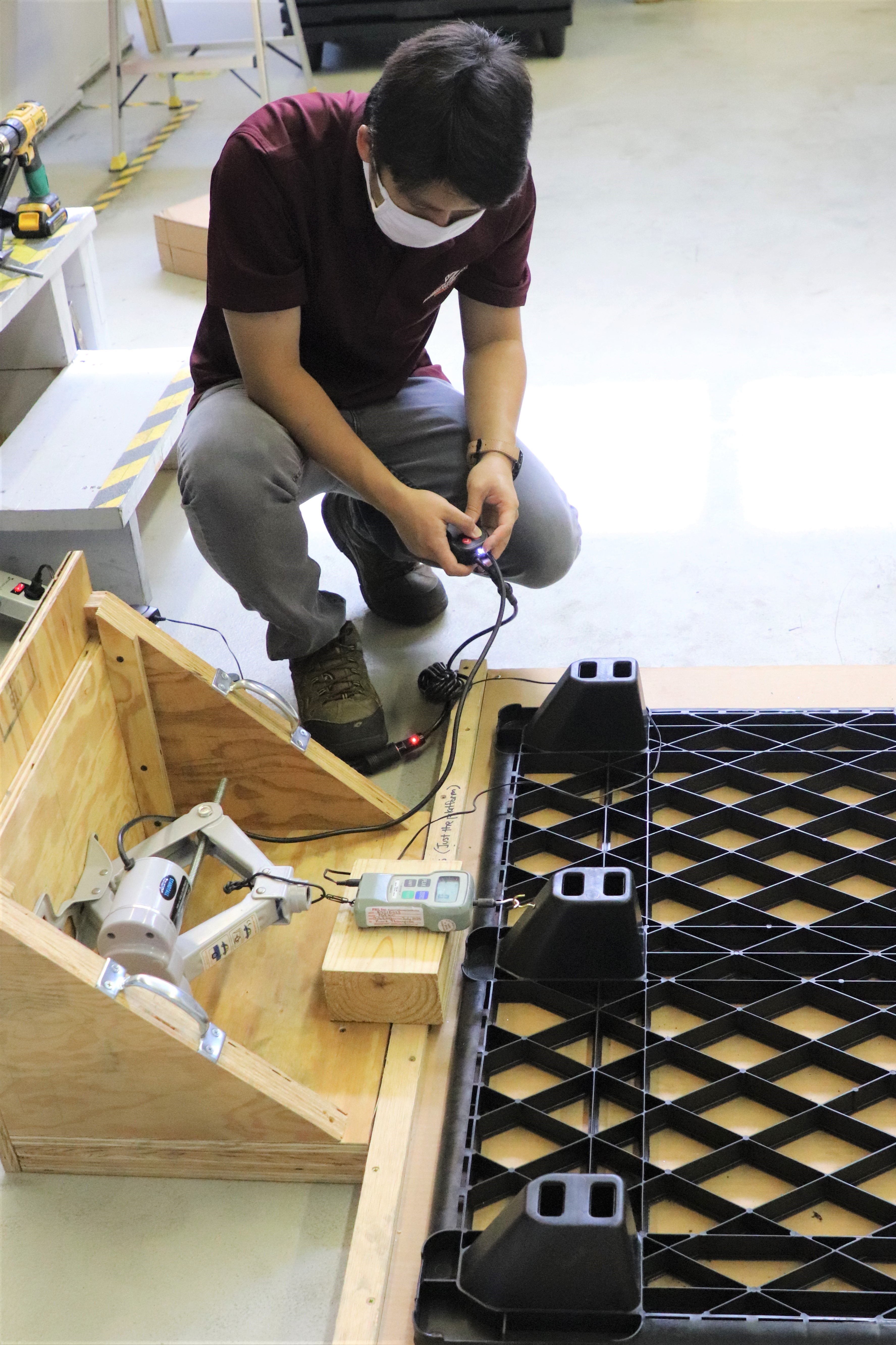 Image 3. Yu Yang conducting a Coefficient of Friction test on the plastic pallet.